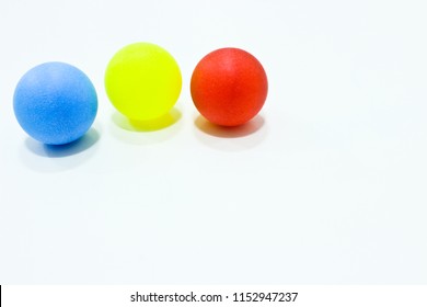 The red, blue and yellow ball on the white background