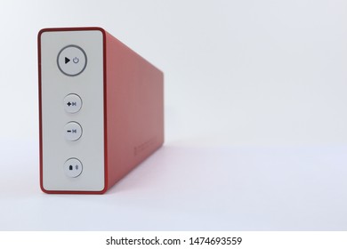 Red Bluetooth Speaker On A White Background