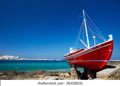 Red Boat On Island Of Mykonos, Greece