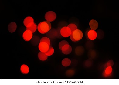 red bokeh on black background