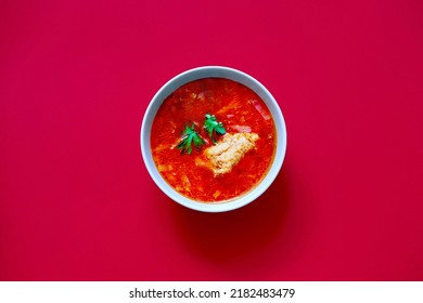 Red Borscht In Bowl On Magenta Color Background, Traditional Dish That Is Cooked With Broth. Culture Of Ukrainian Borscht Cooking - Intangible Heritage. Bold Hues For Basis Designs. Close-up