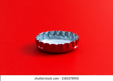 The red bottle cap on a red background