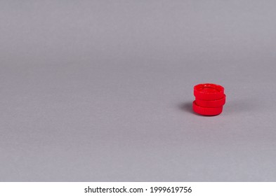 Red Bottle Stoppers Gainsboro Background. Minimalist Composition With Three Plastic Soft Drink Stoppers.