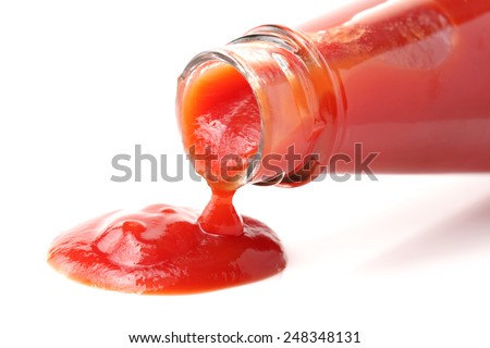 red bottle of Tomato Ketchup on white background