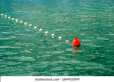 Red Bouy On The Ocean