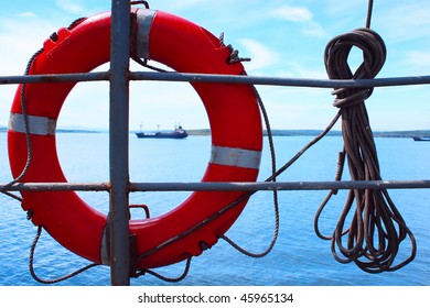 Red Bouy On Ship With Rope