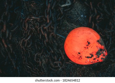 Red Bouy With Rusty Chain