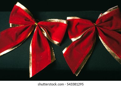 Red Bow On A Black Background,