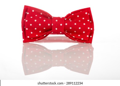 Red bow tie on a white background - Powered by Shutterstock