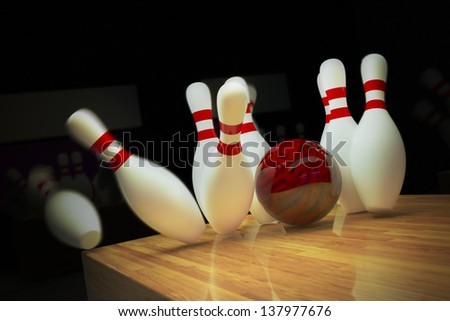 Red bowling ball is making a strike on wooden lane.