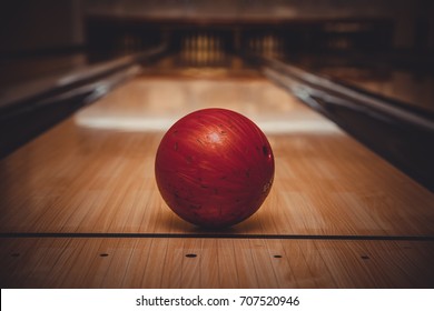 Red Bowling Ball On The Track In The Bowling Center