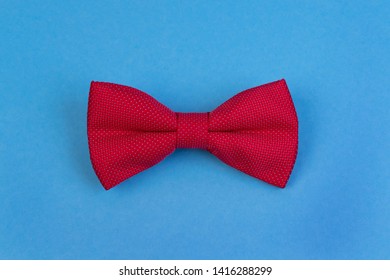 Red bow-tie on blue background. Happy fathers day concept. Minimalistic design - Powered by Shutterstock