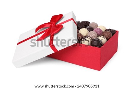 Red box with tasty chocolate candies isolated on white