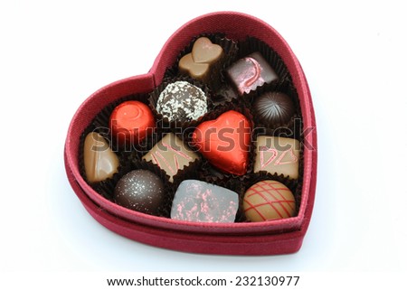 A red box of valentine chocolate for someone special.