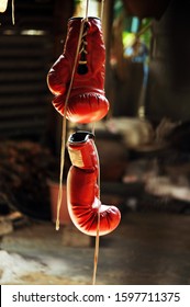 Red Boxing Glove Hanging In Thai Boxing Gym.