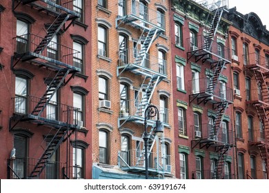 Red Brick Apartment Building With Fire Escape In New York City