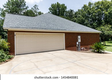 Red brick house cream colored garage