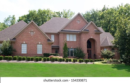 Red Brick House with Shrubs