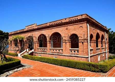A red brick old British Consulate in Kaohsiung under the blue sky.