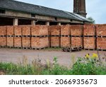 Red brick on pallets in brick factory