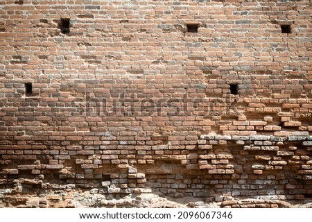 red brick, part of the ruins and ruined walls of medieval buildings , close up. Antique brickwork. The wall of the fort.vintage wall structure. old ruined brickwall.