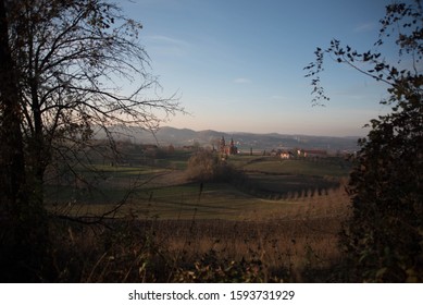 Red Brick Serb Orthodox Christian Church On Warm Winter Sunset In Surrounded With Grass Fields, Old Houses And Sheep In The Village Of Tutnjevac, Bosnia