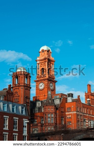 A red brick Victorian side angle building named Palace Hotel in Manchester UK