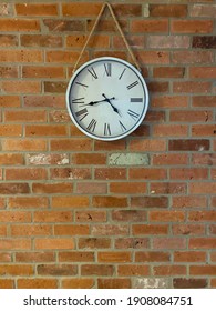 red brick wall with clock