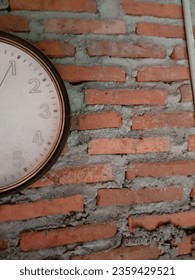 red brick wall and clock