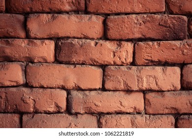 Red brick wall closeup. Old red brick wall texture background