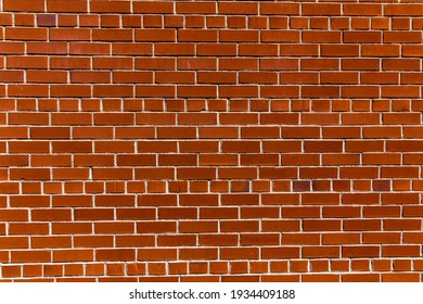 Red brick wall with contrasty sunlight - Shutterstock ID 1934409188