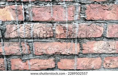 Red brick wall high resolution texture background.Abstract Red bricks texture background. A brick is a type of block used to make walls, pavements and other elements in masonry.