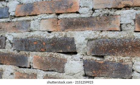 Red Brick Wall Image (background Material), Old Vintage, Architecture Wall Surface. Gruny Wide Brickwall. Building With Damaged Plaster. Unfinished Vintage Wall Background And Texture, Retro.