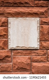 Red Brick Wall With Stone Plaque