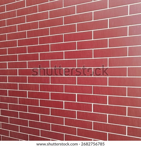 Red brick wall texture or background, close-up with distorted proportions, square image