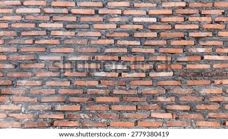 Red brick wall texture background with natural sunlight for construction and interior design.