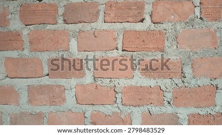 Red Brick Wall Texture Background - Raw Clay Bricks with Cement Mortar Close Up