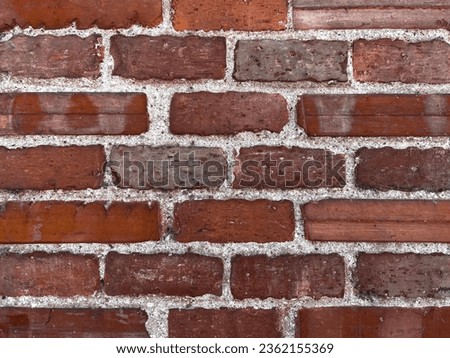 red brick wall texture bonded by concrete