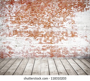 red brick wall and wood floor