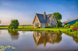 Red Bricks House In Countryside Near The Lake With Mirror Reflection In Water, Amsterdam, Holland, Netherlands, HDR