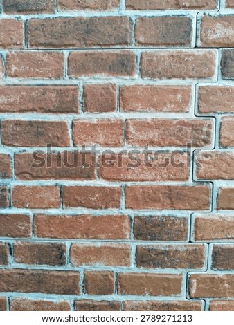 Red bricks are used as building materials that are neatly stacked and arranged