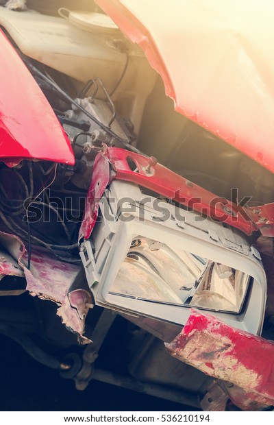 Red broken car after\
accident