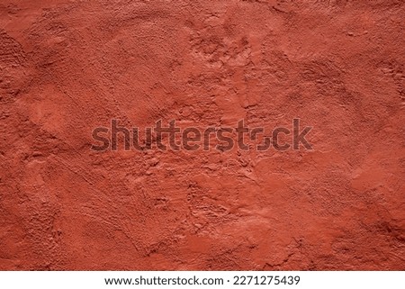 Red brown abstract texture background for design. Painted old wall. Terracotta color. Close-up. Grunge. Damaged rough surface.