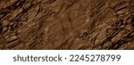 Red brown stone background with space for design. Rock surface texture. Cracked, crumbled, crushed. Rough.  Close-up. Banner. Wide. Long. Panoramic.
