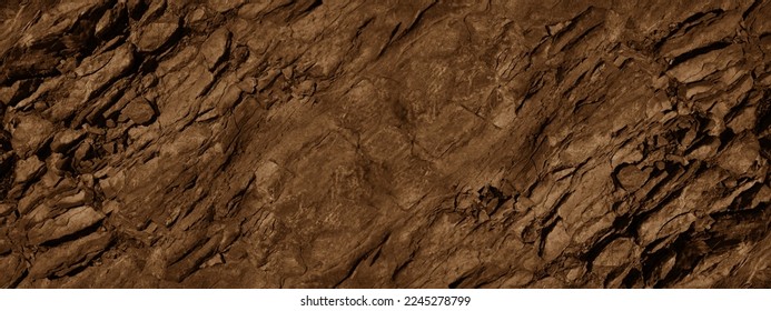 Red brown stone background with space for design. Rock surface texture. Cracked, crumbled, crushed. Rough.  Close-up. Banner. Wide. Long. Panoramic.