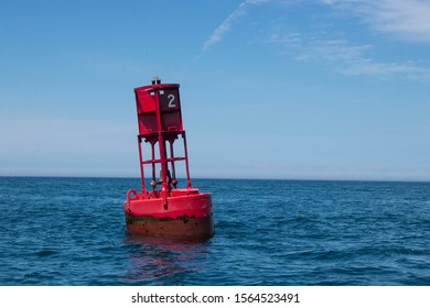 A red buoy in a blue lake - Powered by Shutterstock