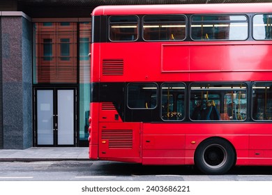 A red bus on the streets in London - Powered by Shutterstock