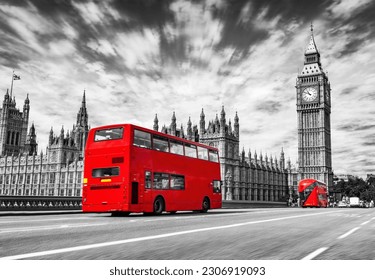 Red bus on Westminster bridge next to Big Ben in London, the UK. Red on black and white