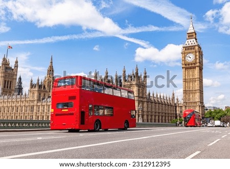 Red bus on Westminster bridge next to Big Ben in London, the UK. Tourist landmark