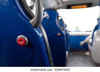 Red Bus Stop Button To Get Off In The Back Of A Seat In A Double-decker Bus. Cambridge, United Kingdom